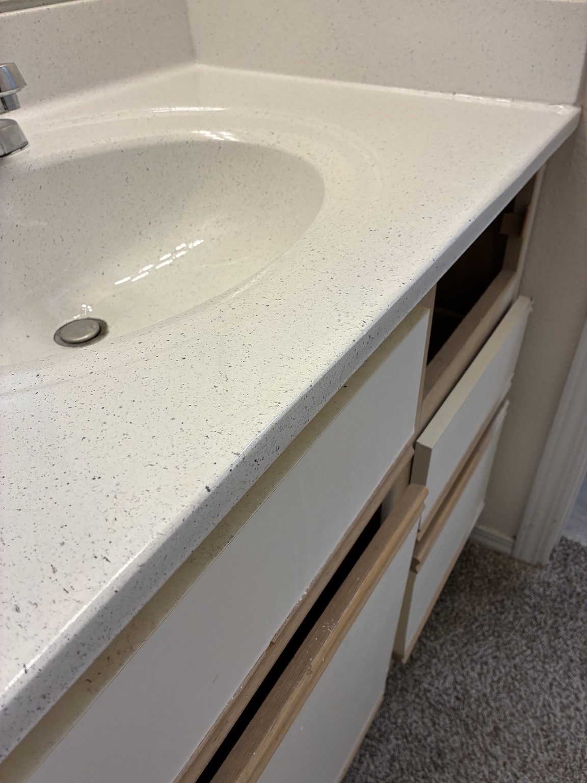 Bathroom countertop after refinishing with speckled finish
